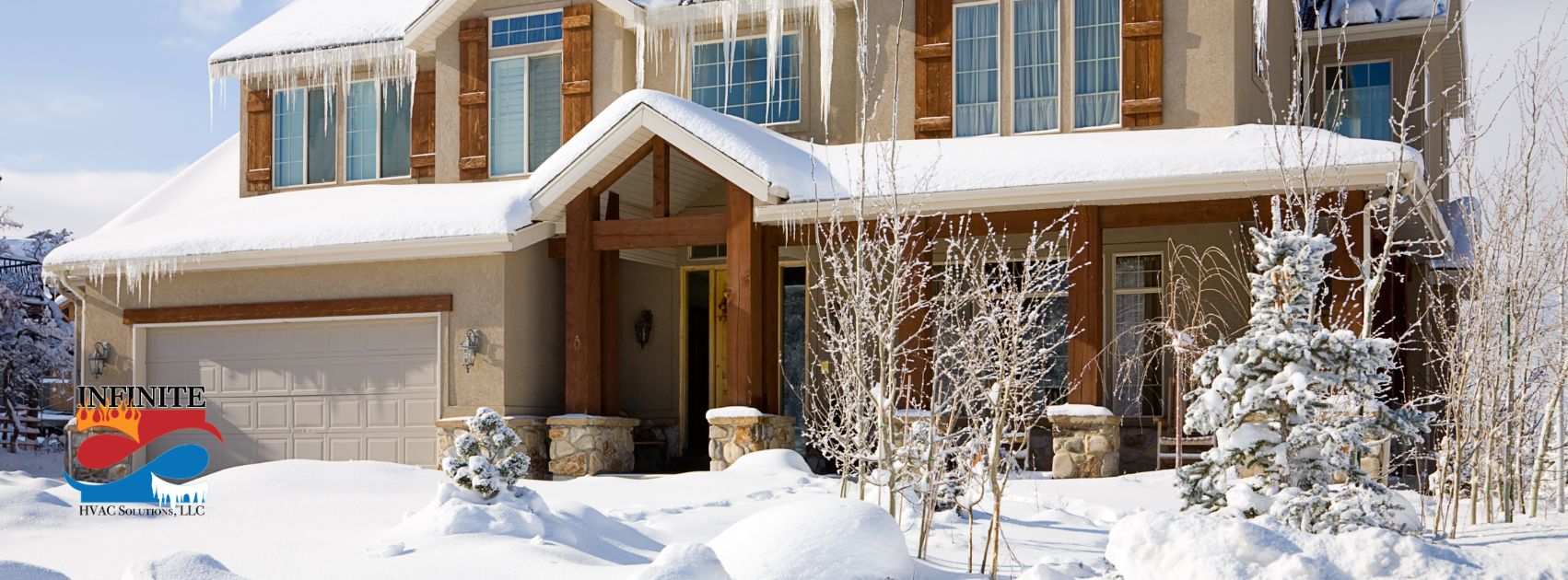 Snow-covered home with icicles on the roof, showcasing winter weather in Connecticut. Ideal for promoting residential heating services by Infinite HVAC Solutions.